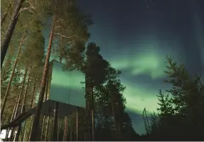  ??  ?? The Northern Lights above the Mirrorcube room at Treehotel, Sweden