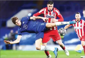  ?? AFP ?? Chelsea’s Spanish defender Marcos Alonso (left) vies with Atletico Madrid’s Uruguayan defender Jose Gimenez during the UEFA Champions League round of 16 second leg football match on Wednesday.
