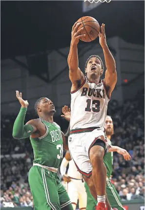  ?? RICK WOOD/ MILWAUKEE JOURNAL SENTINEL ?? The Bucks’ Malcolm Brogdon leads drives on the court and now off the court with one to address the clean-water crisis.