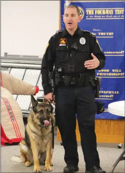  ?? Staff photo/Corey Maxwell ?? New Bremen Police Officer Justin Bruns stAnds with police K-9, Doc, TuesdAy morning At the New Bremen New Knoxville RotAry meeting.