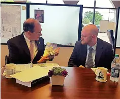  ?? (Photo by Sarah Raines, SDN) ?? Mississipp­i Secretary of State Delbert Hosemann (left) talks about the “Blue Book” to SDN Editor Ryan Phillips (right) in a Facebook Live interview on Wednesday, April 26.