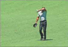  ?? AP ?? Tiger Woods walks the second hole during his third round at the Masters at Augusta National Golf Club on Saturday.