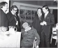  ??  ?? Prince Charles dines with The Goons – Peter Sellers, Michael Bentine and Spike Milligan (slumped in a chair) – Harry Secombe was at home ill