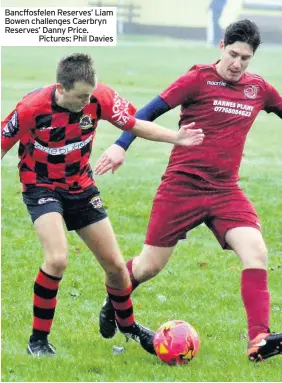  ?? Pictures: Phil Davies ?? Bancffosfe­len Reserves’ Liam Bowen challenges Caerbryn Reserves’ Danny Price.