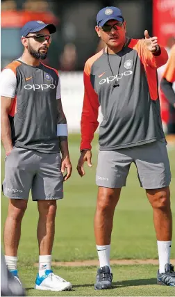  ?? — AP ?? Skipper Virat Kohli and coach Ravi Shastri at a training session at Lord’s on Tuesday.