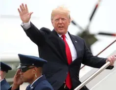  ??  ?? Trump waves as he boards Air Force One to travel to New York from Joint Base Andrews in Maryland, US. — Reuters photo