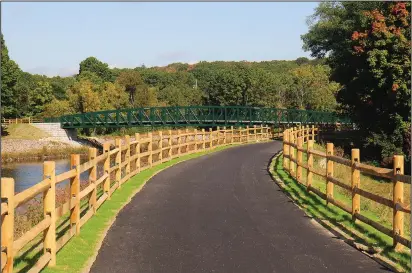  ?? Ernest A. Brown photo ?? New fencing has been completed along the Blackstone Valley Bikeway at Singleton Street in Woonsocket, which leads to the brand new bridge that crosses the Blackstone Rivers connecting the town of Blackstone.