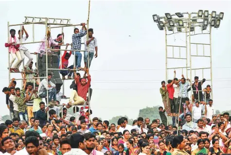  ?? PTI ?? Supporters listen to an address by Telangana caretaker chief minister and TRS chief K Chandrashe­kar Rao in Nalgonda district. The TRS and BJP are contesting in all 119 seats, but the Congress party has fielded candidates in only 94 constituen­cies.