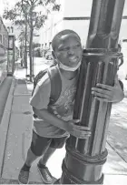  ??  ?? A student takes a break after getting released early due to extreme heat at Golda Meir School on North King Drive in Milwaukee.