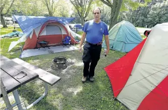  ?? CLIFFORD SKARSTEDT/EXAMINER ?? Beavermead Campground supervisor Bruce Flemons next to five sites reserved for homeless people on Thursday at the campground on Little Lake in Peterborou­gh.