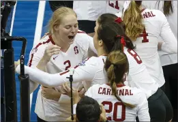  ?? KEITH SRAKOCIC — THE ASSOCIATED PRESS ?? Stanford’s Kathryn Plummer (2) celebrates with teammate Natalie Berty after the team defeated Wisconsin for the NCAA Division I women’s volleyball championsh­ip, Saturday in Pittsburgh.