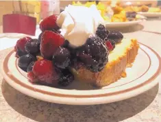  ?? JASON K. WATKINS/FOR THE JOURNAL ?? A homemade lemon pound cake, smothered in fresh strawberri­es, blueberrie­s and blackberri­es, and topped with delicious, fresh whipped cream at Thur Shan Buffet.