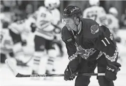  ?? CHRISTIAN PETERSEN/GETTY IMAGES ?? Dylan Guenther (11) of the Coyotes warms up before a game against the Boston Bruins on Jan. 9 at Mullett Arena in Tempe.