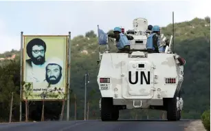  ?? (Ali Hashisho/Reuters) ?? UNIFIL peacekeepe­rs patrol yesterday in the southern Lebanese town of Ramiyeh.