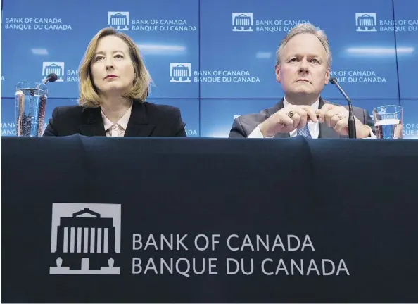  ?? ADRIAN WYLD/THE CANADIAN PRESS ?? A major reason that the Bank of Canada — led by governor Stephen Poloz and senior deputy governor Carolyn Wilkins — is unlikely to continue raising rates is the uncertaint­y stoked by U.S. President Donald Trump’s threats to end NAFTA, writes Kevin...