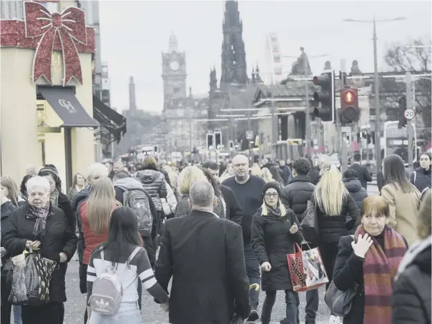  ??  ?? 0 Shoppers were out in force yesterday, with many retailers already offering major discounts in a bid to reverse sliding sales ahead of Christmas