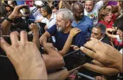  ?? LALO DE ALMEIDA / THE NEW YORK TIMES ?? Brazil’s former president, Luiz Inacio Lula da Silva, or “Lula,” greets supporters in Sao Bernardo do Campo, Brazil, in April.