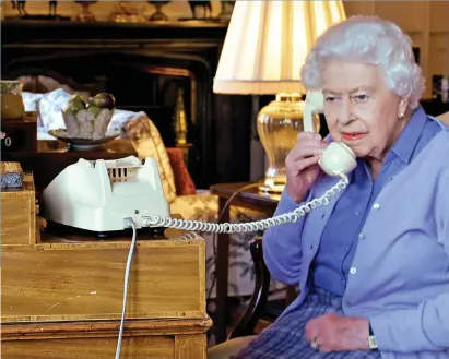  ??  ?? Lines of communicat­ion: The Queen talking to Boris Johnson from Windsor Castle last month