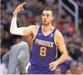  ??  ?? Phoenix Suns forward Frank Kaminsky (8) makes a 3-pointer against the Clippers in the second half on Saturday in Phoenix, Ariz.