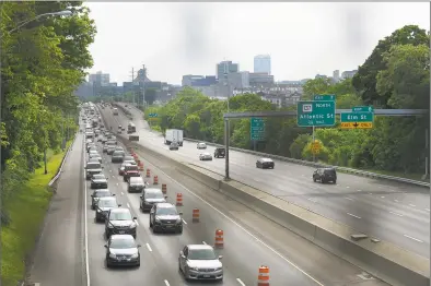  ?? Matthew Brown / Hearst Connecticu­t Media ?? Traffic backs up through downtown Stamford as work crews work to remove a dilapidate­d Route 1 bridge on Saturday that spans Interstate 95 at Exit 9 in Stamford making way for new spans of prefabrica­ted bridge. Workers will use a Self Propel Modular Transport system to roll one of two spans into place overnight.