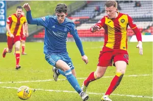  ?? Picture: SNS. ?? Ryan Christie and Andy Mccarthy in action at Firhill.