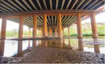  ?? ADOLPHE PIERRE-LOUIS/JOURNAL ?? The Rio Grande barely flows under the Interstate 40 bridge in Albuquerqu­e in August.