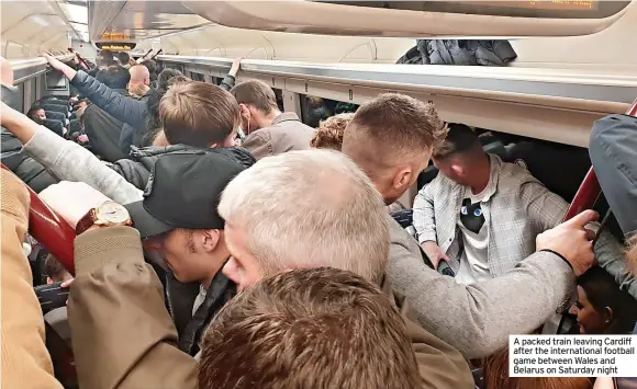  ?? ?? A packed train leaving Cardiff after the internatio­nal football game between Wales and Belarus on Saturday night