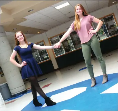  ?? Ernest A. Brown photo ?? Nicole Ethier, Burrillvil­le Class of 2018 salutatori­an, left, and her twin sister, Elizabeth, the Class of 2018 valedictor­ian, are pictured in the lobby outside the school’s gymnasium on Friday.