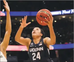  ?? John Raoux / Associated Press ?? UConn forward Napheesa Collier drives to the basket during the first half of Friday’s semifinal game against Notre Dame in Tampa, Fla.