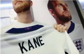  ?? ?? The multicolou­red St George’s Cross on the back of the new England shirt. Photograph: Andy Rain/EPA