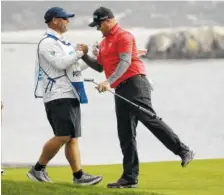  ?? THE ASSOCIATED PRESS ?? Ted Potter Jr., right, is greeted by his caddie after winning the AT&T Pebble Beach National Pro-Am on Sunday in Pebble Beach, Calif.