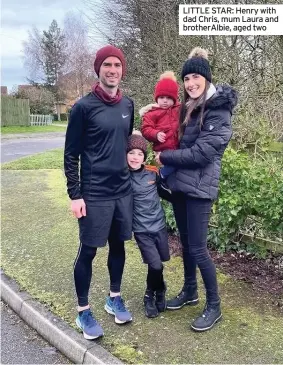  ??  ?? LITTLE STAR: Henry with dad Chris, mum Laura and brotherAlb­ie, aged two