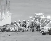  ?? JOE BURBANK/STAFF FILE PHOTO ?? Kyle Busch is loaded into an ambulance after a crash during an Xfinity Series race at Daytona Internatio­nal Speedway in February.