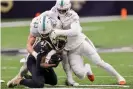  ?? ?? Saints running back Alvin Kamara (41) is tackled by Dolphins inside linebacker Andrew Van Ginkel (43) and outside linebacker Jaelan Phillips (15) during Monday’s second half. Photograph: Stephen Lew/USA Today Sports