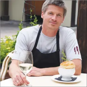  ?? SHELORA SHELDAN/Special to The Herald ?? Chef Mark Ashton of the Patio Restaurant at Lake Breeze Winery with the halibut pot pie.