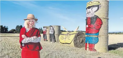  ?? Picture: Gareth Jennings. ?? Fleur Baxter from East Skichen farm with her Dennis the Menace and Desperate Dan bales.