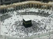  ?? AMR NABIL — THE ASSOCIATED PRESS ?? A relatively few number of Muslims pray around the Kaaba, the cubic building at the Grand Mosque, in the Muslim holy city of Mecca, Saudi Arabia, Wednesday.