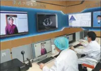  ?? XU CONGJUN / FOR CHINA DAILY ?? Doctors respond to online patient queries at a hospital in Nantong, Jiangsu province, in May.