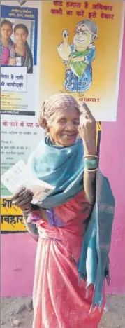  ?? PTI ?? An elderly voter shows her finger marked with indelible ink as she comes out of a polling station after casting her vote for the second phase of assembly elections, at Kunkuri in Jashpur district, of Chhattisga­rh, on Tuesday.