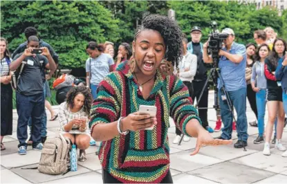  ?? | MAX HERMAN/ FOR THE SUN- TIMES ?? Deja Boyd, 17, performs a poem during the Pop- up Soapbox, part of the Mikva Challenge mass action day at the Cloud Gate on Monday.