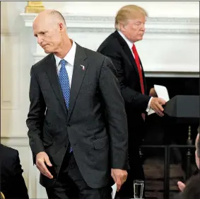  ?? AP/EVAN VUCCI ?? Gov. Rick Scott, R-Fla., walks off after speaking about school safety during a meeting with President Donald Trump and members of the National Governors Associatio­n in the State Dining Room of the White House on Monday in Washington.