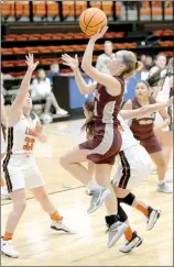  ?? Andy Shupe/NWA Democrat-Gazette ?? Siloam Springs senior Sydney Moorman (center) leaps to score against Gravette in the Lady Panthers’ season opener on Nov. 10. Moorman is averaging 8.5 points per game for the Lady Panthers, who are scheduled to play at Greenbrier on Friday.