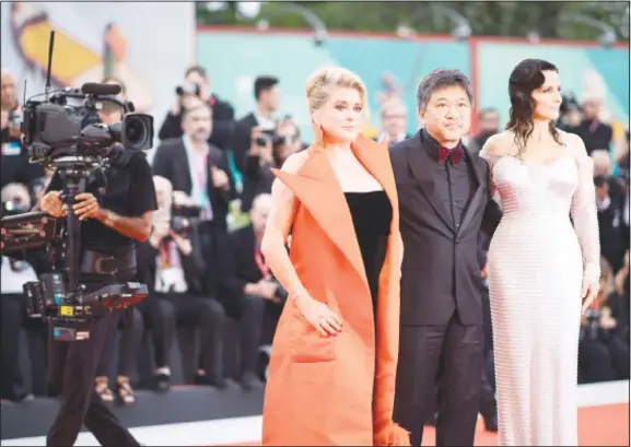  ??  ?? Actress Juliette Binoche (from right), director Hirokazu Kore-eda and actress Catherine Deneuve pose for photograph­ers upon arrival at the premiere of the film ‘The Truth’ and the opening gala at the
76th edition of the Venice Film Festival in Venice, Italy on Aug 28. (AP)