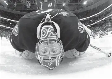  ?? Bruce Bennett
Getty Images ?? BEN BISHOP stretches between periods in Game 2. The Tampa Bay goaltender labored through Game 3 and couldn’t play in Game 4. He might not be back for Saturday’s Game 5, after sitting out practice Friday.