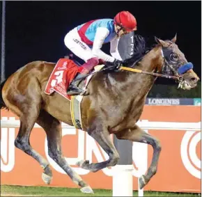  ?? AFP ?? Jockey Lanfranco Dettori takes part in the Dubai World Cup horse racing event at the Meydan racecourse in the Gulf emirate on Saturday.