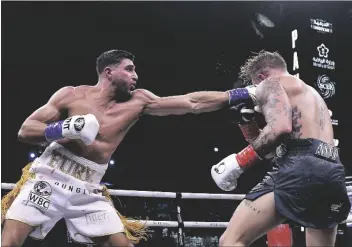  ?? STR/AP ?? JAKE PAUL, RIGHT, AND TOMMY FURY, IN ACTION DURING THEIR BOXING MATCH, IN RIYADH, SAUDI ARABIA, EARLY MONDAY, FEB. 27, 2023.