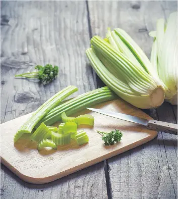  ??  ?? To keep celery crisp, instead of lying limply in your refrigerat­or, keep the stalks wrapped tightly in aluminum foil.