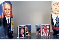  ??  ?? Firestarte­rs: Matchboxes with pictures of Putin and Trump in a shop window in Helsinki. — Reuters