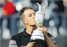  ?? MATT DUNHAM/THE ASSOCIATED PRESS ?? Henrik Stenson of Sweden kisses the Claret Jug after winning the British Open on Sunday.