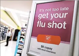  ?? JUSTIN SULLIVAN/GETTY ?? This year’s flu shot targets the strains that are making Americans sick, mainly the H3N2 flu virus. But exactly how effectivel­y it is working won’t be known until next month.